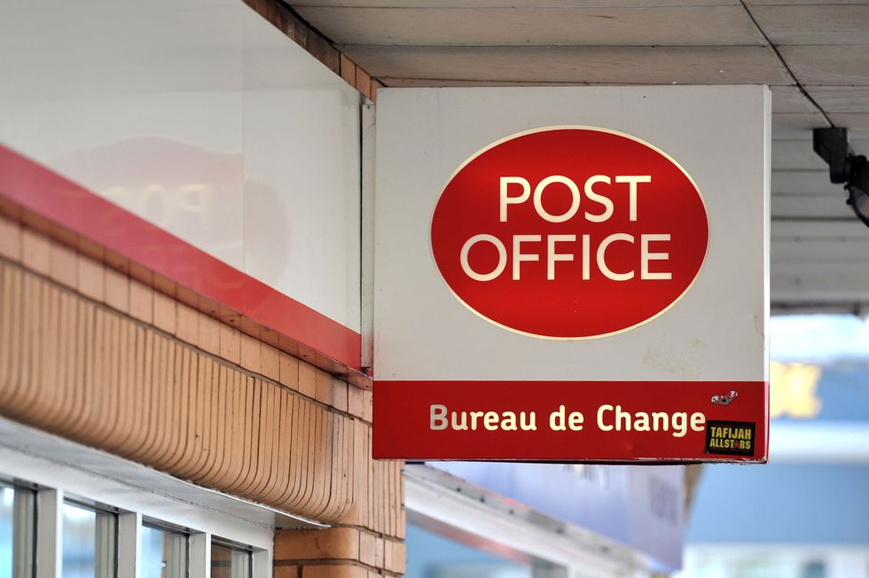 File photo dated 07/05/13 of a Post Office sign, as Post Office workers will today stage a one-day strike in a dispute over pay.