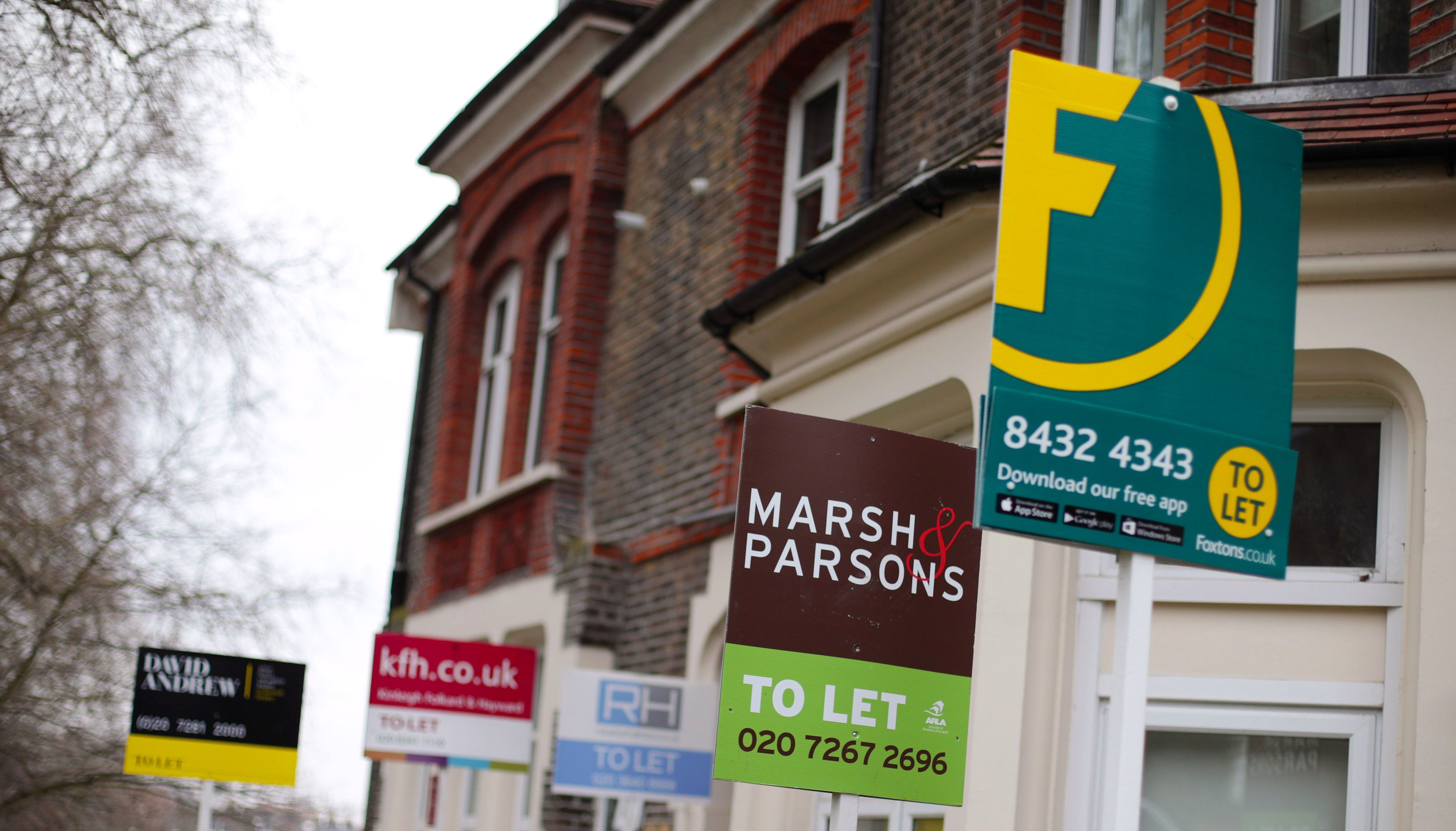 File photo dated 08/02/17 of a row of To Let estate agent signs placed outside houses in north London. Renting a home is now cheaper than buying one typically, reversing a trend seen for the past six years, a report has found. Last month the average private sector tenant in Britain spent 71 per month less in rent than if they were servicing the repayments on a 10 percent deposit mortgage, according to estate and lettings agents Hamptons. Issue date: Monday June 14, 2021.