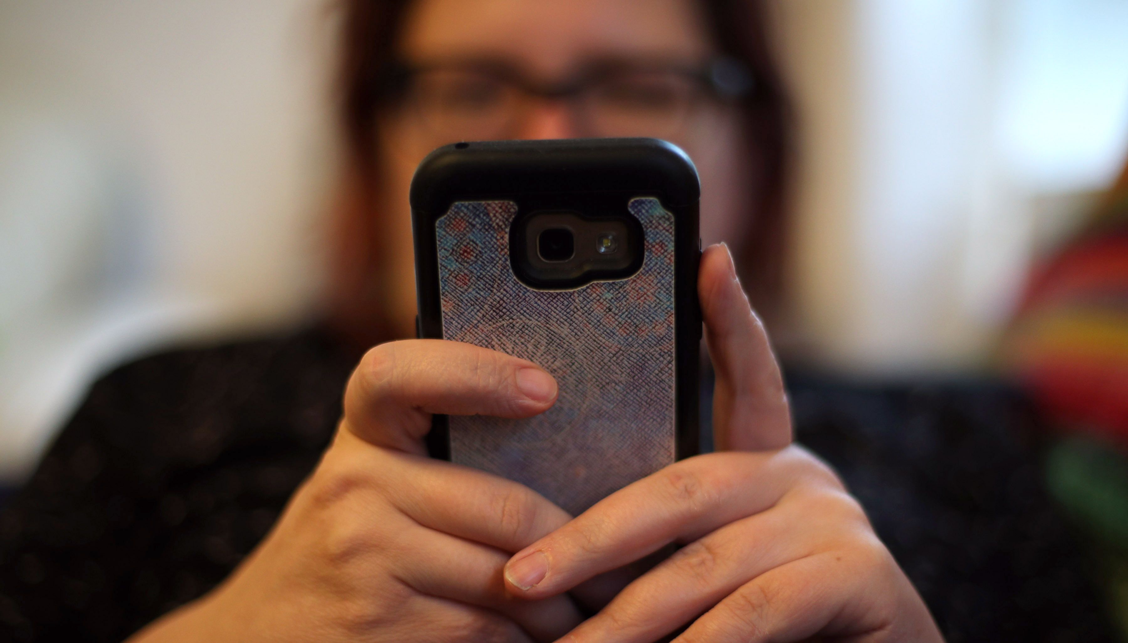 File photo dated 08/05/19 of a woman using her mobile phone, as rape victims are still being asked to hand over their mobile phones as part of %22excessive%22 police scrutiny, nearly a year on from a Government pledge to overhaul how cases are investigated, the data watchdog has warned. Issue date: Tuesday May 31, 2022.