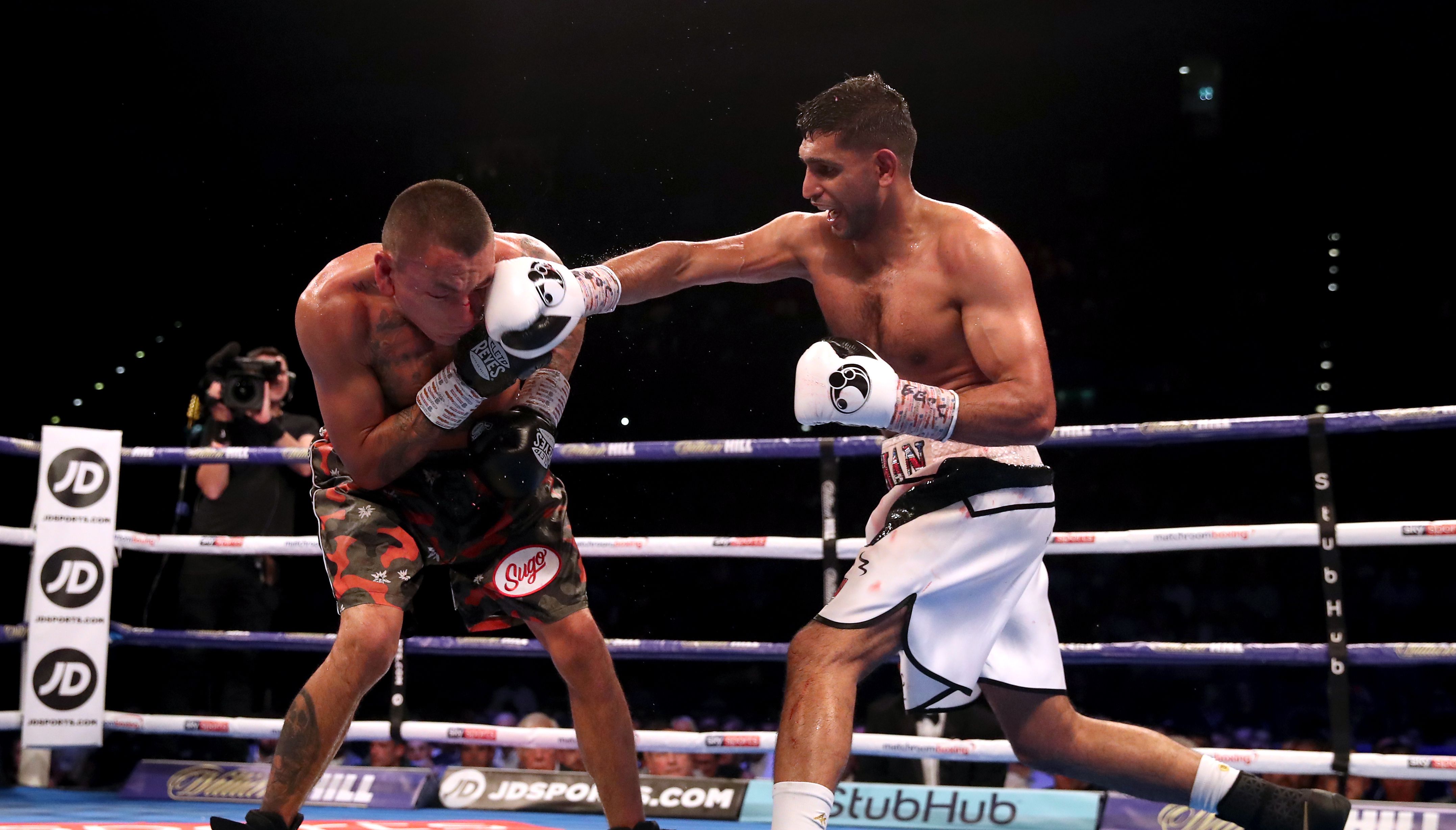 File photo dated 08-09-2018 of Amir Khan (right), the 2004 Olympic silver medallist who became a unified world champion at light-welterweight, who has announced the end of his in-ring career. Issue date: Friday May 13, 2022.