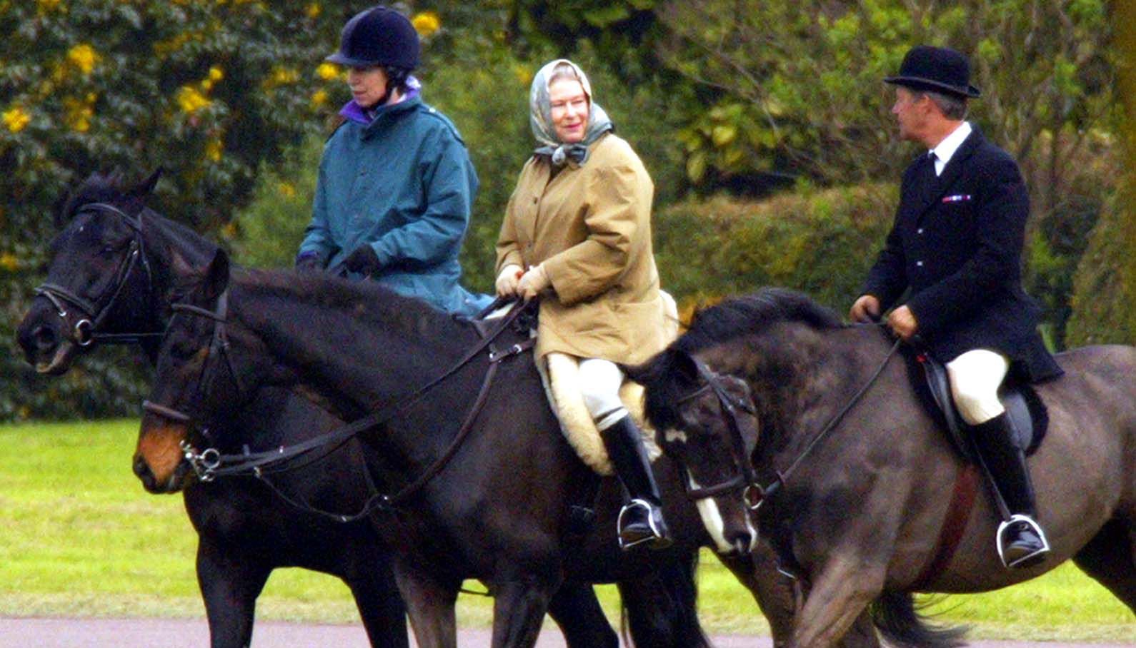 File photo dated 1/4/2002 of Queen Elizabeth II and her daughter, the Princess Royal, riding near Windsor Castle where members of the Royal family had gathered to mourn the death of Queen Elizabeth the Queen Mother, who died 30/3/02, aged 101. More than any other interest, horses and ponies have been the Queen's passion throughout her long life. Issue date: Sunday January 30, 2022.
