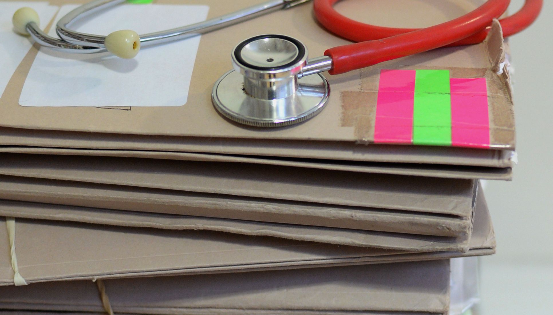 File photo dated 10/09/14 of a stethoscope on top of patient's files, as only one in 10 patients using an online system actually requests to see their GP face-to-face, according to study of more than 7.5 million records.