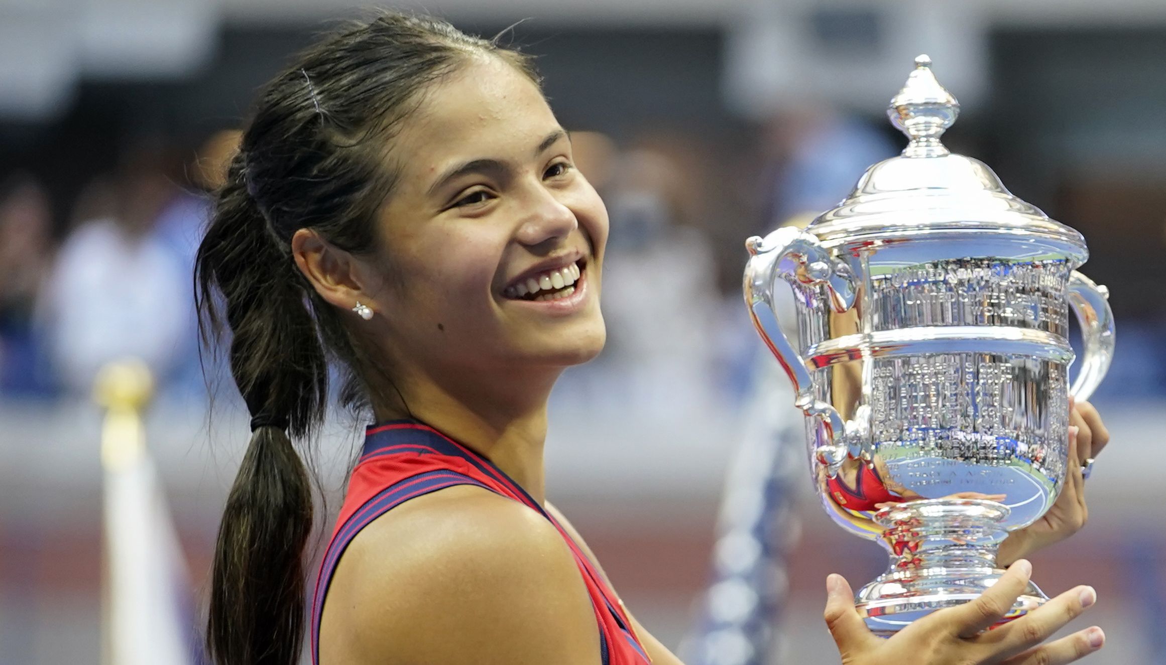 File photo dated 11-09-2021 of Great Britain's Emma Raducanu holds the trophy as she celebrates winning the women's singles final. Emma Raducanu's US Open triumph provides a golden opportunity to grow tennis in Britain. Issue date: Monday March 7, 2022.
