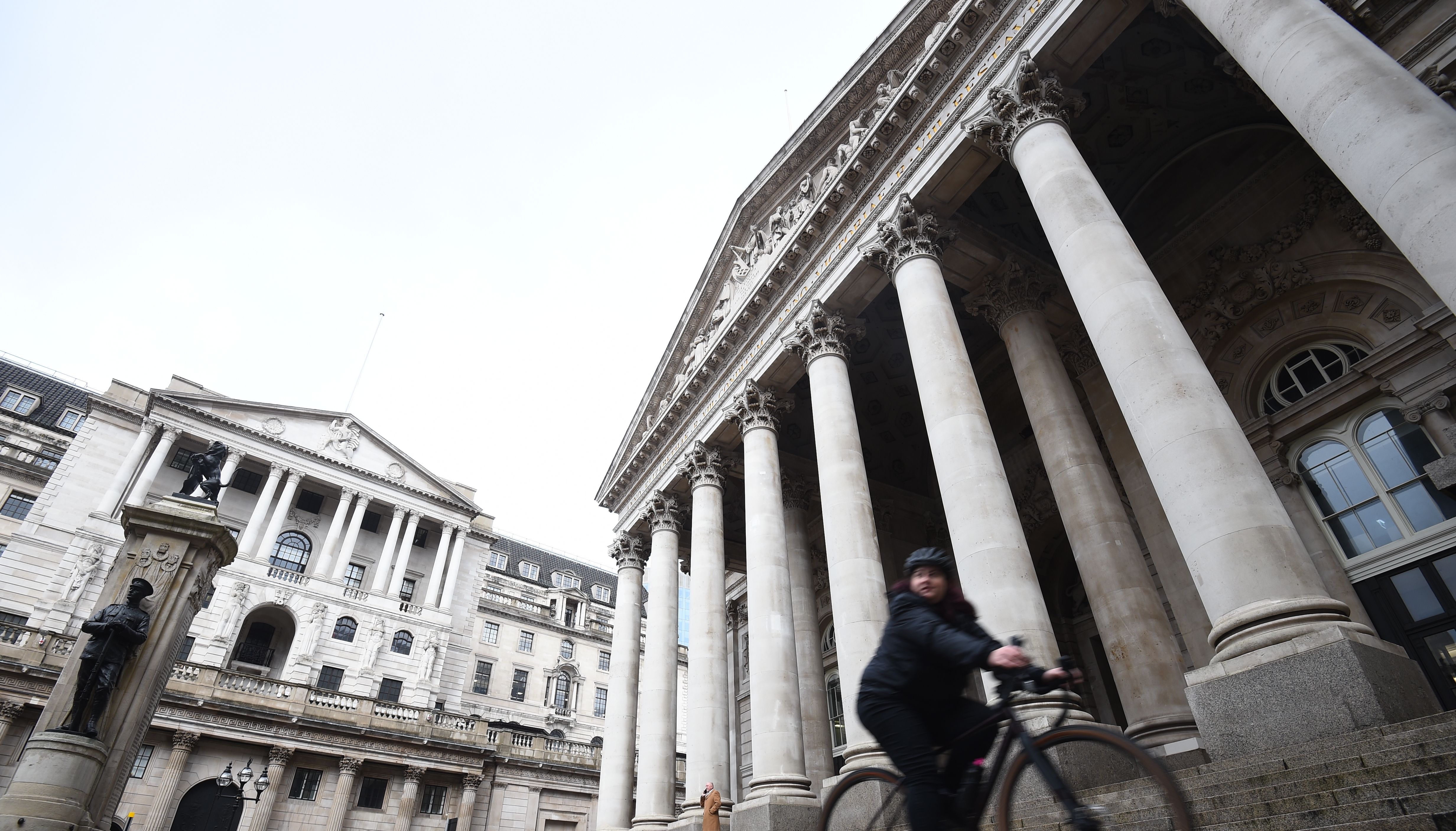File photo dated 11/12/20 of a woman cycling past the Bank of England and the Royal Exchange in the City of London. Markets think the Bank of England will unveil the biggest hike in interest rates for over three decades when its decision makers meet on Thursday. Issue date: Thursday September 22, 2022.
