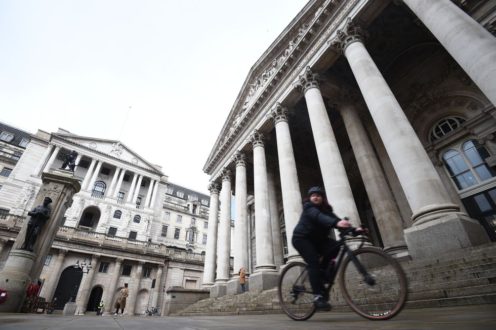 File photo dated 11/12/20 of a woman cycling past the Bank of England and the Royal Exchange in the City of London. The Bank of England is expected to push interest rates even higher next week at its latest meeting, putting further pressure on mortgages. Issue date: Sunday December 11, 2022.