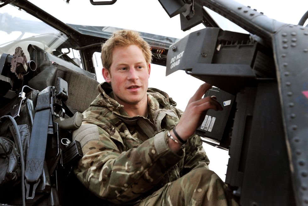 File photo dated 12/12/2012 of Prince Harry or Captain Wales as he was known in the British Army, making his early morning pre-flight checks in the cockpit, at Camp Bastion, southern Afghanistan. The Duke of Sussex has consoled Lee Spencer, a former royal marine who had to pull out of an epic Triathlon of Great Britain challenge, telling him he should be %22really proud%22 of his achievements. Harry video-called Lee, a single leg amputee, who was left devastated when forced, due to injury, to end his bid to swim the English Channel, cycle from Lands End to John O'Groats and climb the three highest peaks in England, Scotland and Wales. Issue date: Wednesday August 31, 2022.