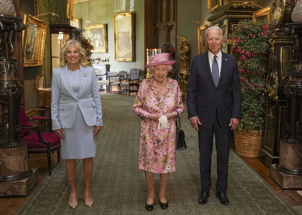 File photo dated 13/06/2021 of Queen Elizabeth II (centre) with US President Joe Biden and First Lady Jill Biden in the Grand Corridor during their visit to Windsor Castle in Berkshire. The Queen died peacefully at Balmoral this afternoon, Buckingham Palace has announced. Issue date: Thursday September 8, 2022.