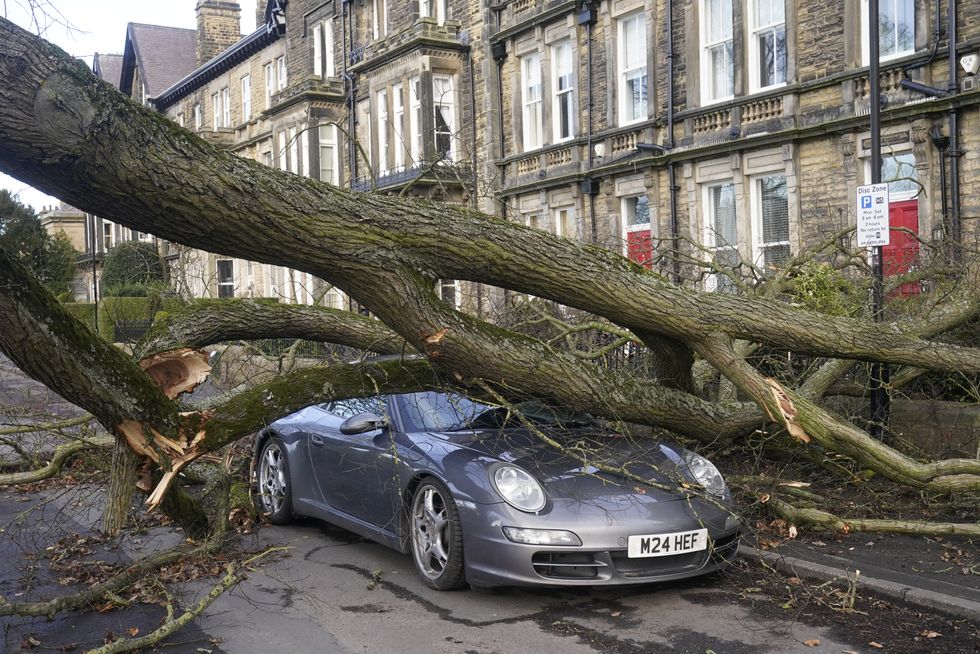 File photo dated 17/02/23 of a Porsche 911 car is damaged by a fallen tree in Harrogate, North Yorkshire, as a result of storm Otto. About 2,000 homes which lost power during Storm Otto had still not been reconnected to the grid on Saturday morning. The Met Office said the storm has %22well and truly cleared%22 but around 2,000 homes in Aberdeenshire remain without power. Issue date: Saturday February 18, 2023.