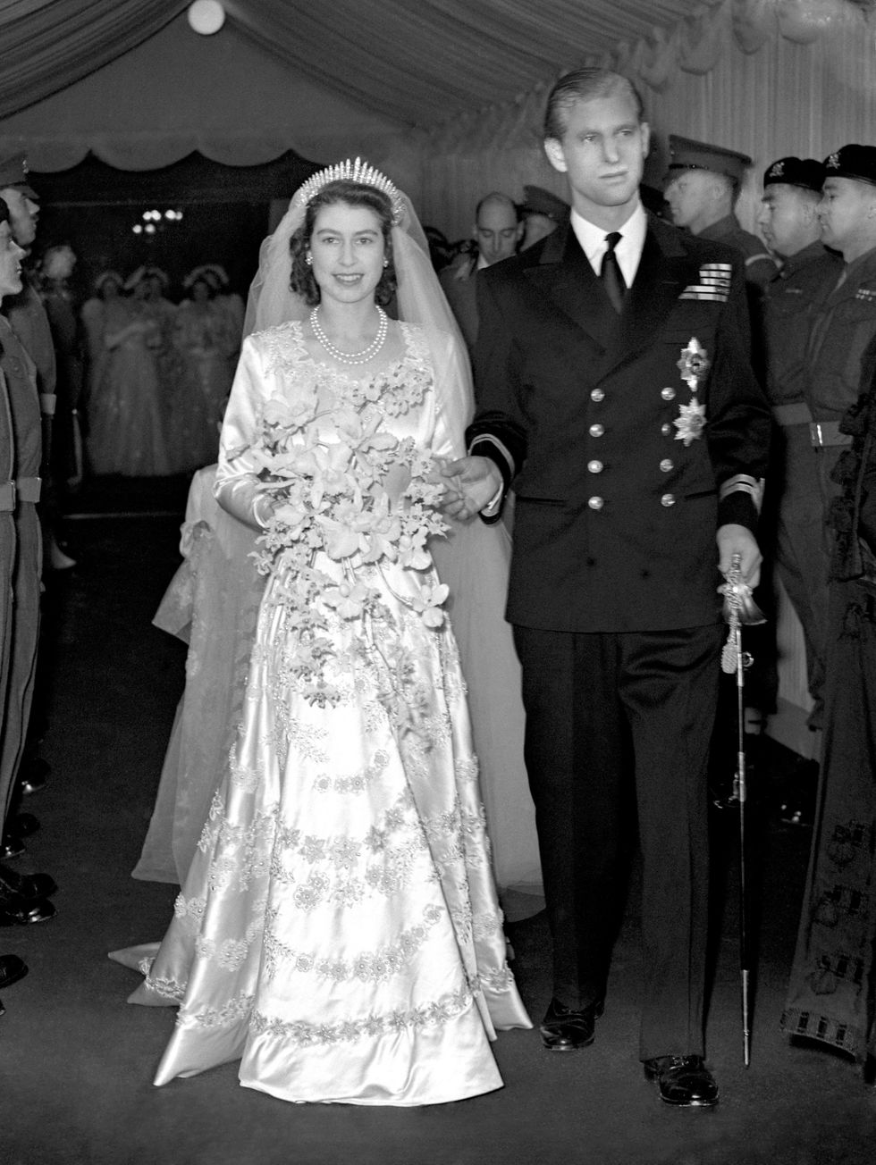 File photo dated 20/11/1947 of Princess Elizabeth and the Duke of Edinburgh (formerly Lt Philip Mountbatten, RN) as they leave Westminster Abbey after their marriage ceremony. The Royal couple were the country???s Prince Charming and Fairy Princess and their wedding in Westminster Abbey captured the public imagination in the austere post-war days as the first great state occasion in the post-war years and a distraction from the hardships the Second World War had imposed. Britain had been battered by its conflict with Germany, rationing was widespread and glamour in short supply. Issue date: Thursday September 8, 2022.