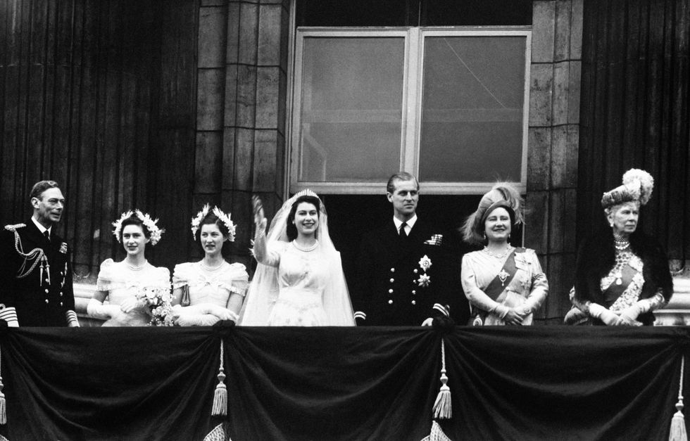 File photo dated 20/11/1947 of the royal wedding party appear on the balcony of Buckingham Palace after Princess Elizabeth (later Queen Elizabeth II) was married to Lieutenant Philip Mountbatten (later the Duke of Edinburgh) in a ceremony at Westminster Abbey. From left: King George VI, Princess Margaret, unidentified, the bride Princess Elizabeth (later Queen Elizabeth II), the groom Lieutenant Philip Mountbatten later Duke of Edinburgh), the Queen Mother and Queen Mary, widow of George V. The Royal couple were the country???s Prince Charming and Fairy Princess and their wedding in Westminster Abbey captured the public imagination in the austere post-war days as the first great state occasion in the post-war years and a distraction from the hardships the Second World War had imposed. Britain had been battered by its conflict with Germany, rationing was widespread and glamour in short supply. Issue date: Thursday September 8, 2022.