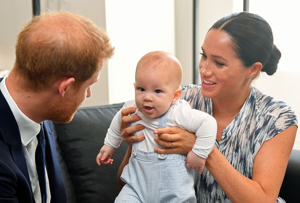 File photo dated 25/9/2019 of the Duke and Duchess of Sussex holding their son Archie during a meeting with Archbishop Desmond Tutu and Mrs Tutu at their legacy foundation in Cape Town, on day three of their tour of South Africa. The Duke and Duchess of Sussex's son, Archie Mountbatten-Windsor, is now technically a prince - a title which Meghan controversially claimed was previously denied to him because of his race. His younger sister, Lilibet %22Lili%22 Mountbatten-Windsor, is also entitled to be a princess following the death of the Queen and with her grandfather, the Prince of Wales, becoming King. Issue date: Thursday September 8, 2022.