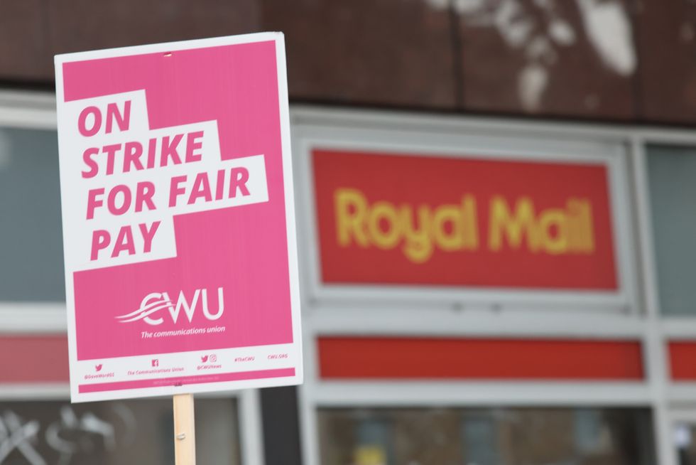 File photo dated 26/08/22 of a sign held by a postal worker from the Communication Workers Union (CWU) on the picket line at the Royal Mail Whitechapel Delivery Office in east London. Royal Mail workers will stage a fresh strike on Tuesday in a long-running dispute over pay and conditions. Members of the CWU will mount picket lines outside sorting and delivery offices across the country. Issue date: Monday October 24, 2022.