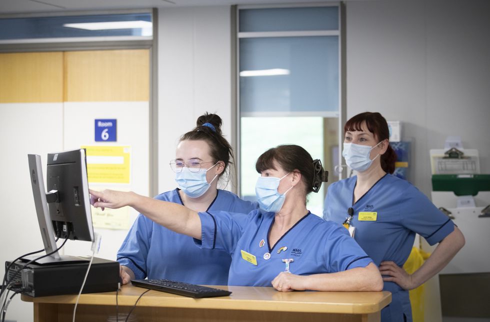 File photo dated 27/01/21 of nurses working at the nurses station, as nurses are to hold two days of strike action next month in a dramatic escalation of the pay row raging across the NHS.