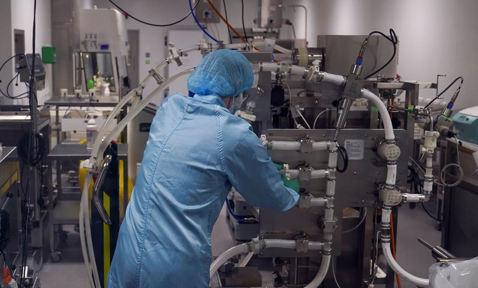 File photo dated 28/07/2021 of a staff member working in a laboratory, as there are more than a million fewer workers in the UK since before the pandemic, with around 400,000 of these no longer in jobs because of health factors such as long Covid, according to a think tank.