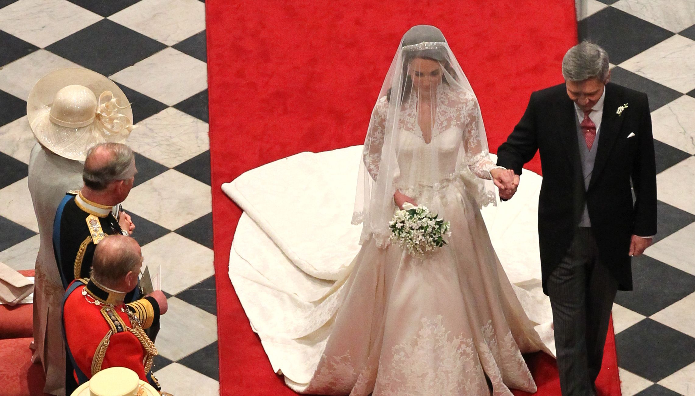 File photo dated 29/04/11 of bride Kate Middleton (now Princess of Wales) walks down the isle with father Michael at Westminster Abbey for her wedding to then Prince William (now Prince of Wales). Prince Harry (now Duke of Sussex) was best man at the wedding. Issue date: Saturday January 7, 2023.