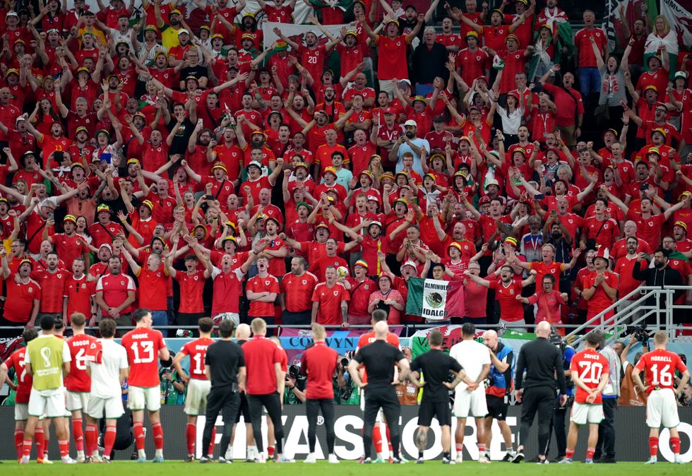 File photo dated 29-11-2022 of Wales players applaud the travelling supporters following the FIFA World Cup Group B match at the Ahmad Bin Ali Stadium, Al Rayyan, Qatar. Wales waited 64 years to play at a World Cup and ended up getting knocked out by England. Issue date: Saturday December 17, 2022.