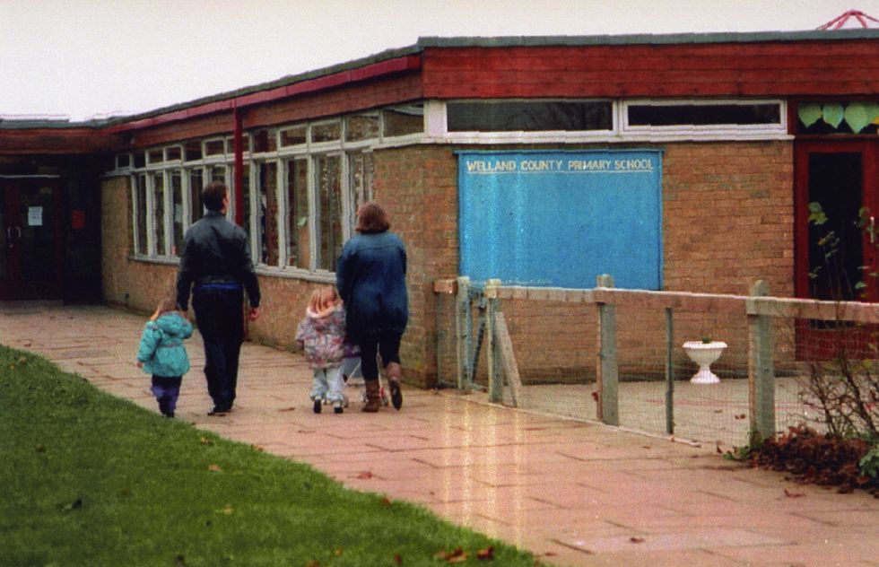 File photo dated 30/11/94 of parents escorting their children to Welland County Primary School, Peterborough, where six-year-old Rikki Neave was a pupil. James Watson has been found guilty by majority verdict at the Old Bailey, London, of the murder of six-year-old Rikki who was found strangled in woodland 25 years ago, when the defendant was a boy of 13. Issue date: Thursday April 21, 2022.