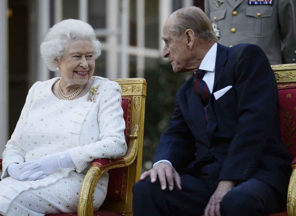 File photo dated 5/6/2014 of Queen Elizabeth II and the Duke of Edinburgh attend a garden party in Paris, hosted by Sir Peter Ricketts, Britain's Ambassador to France ahead of marking the 70th anniversary of the D-Day landings during World War II. The memorial service for the Duke will pay tribute to Philip's dedication to %22family, Nation and Commonwealth%22, his contribution to public life and his steadfast support to his charities, Buckingham Palace has said. Issue date: Thursday March 24, 2022.
