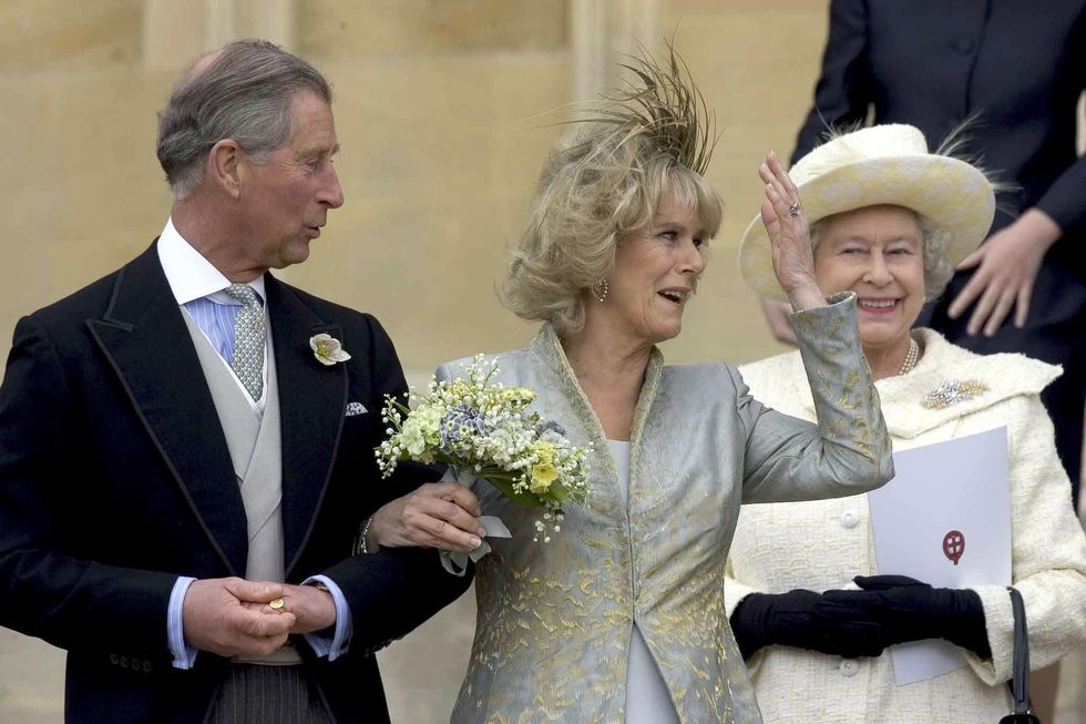 File photo dated 9/4/2005 of Prince Charles, the Prince of Wales, and Camilla the Duchess of Cornwall, leaving St George's Chapel, Windsor, watched by Queen Elizabeth II following the blessing of their wedding. Issue date: Thursday September 8, 2022.