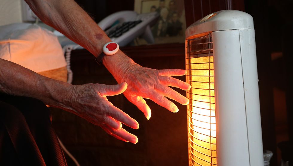 File photo dated of a 19/11/14 of an elderly lady with her electric fire on at home in Liverpool. A %22significant humanitarian crisis with millions of children's development blighted%22 is on the way if the Government does not act to prevent more than half of UK households plunging into fuel poverty, experts have warned. Issue date: Thursday September 1, 2022.