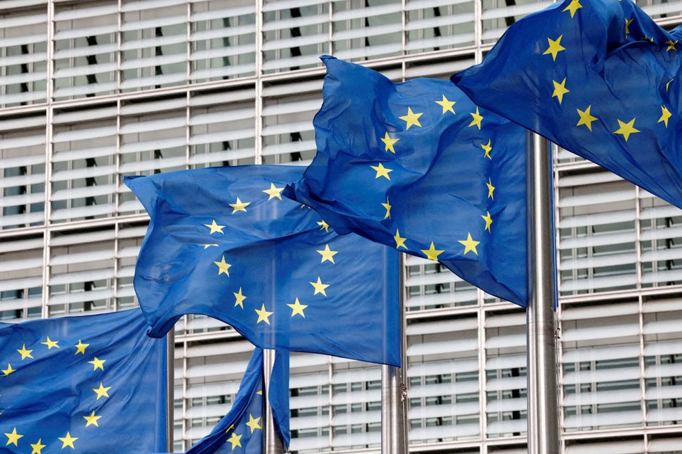 FILE PHOTO: European Union flags flutter outside the EU Commission headquarters in Brussels, Belgium, September 28, 2022. REUTERS/Yves Herman//File Photo