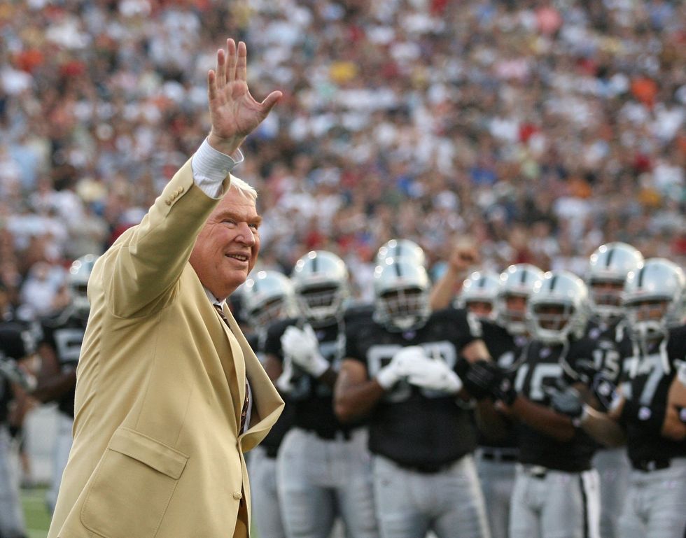 FILE PHOTO: Former Oakland Raiders head coach John Madden waves to the crowd before the AFC-NFC Hall of Fame pre-season game in Canton, Ohio, August 6, 2006. REUTERS/Matt Sullivan/File Photo
