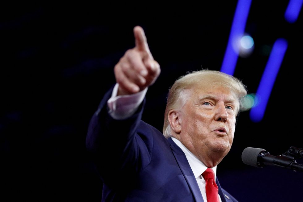 FILE PHOTO: Former U.S. President Donald Trump gestures as he speaks during the Conservative Political Action Conference (CPAC) in Orlando, Florida, U.S. February 26, 2022. REUTERS/Marco Bello//File Photo