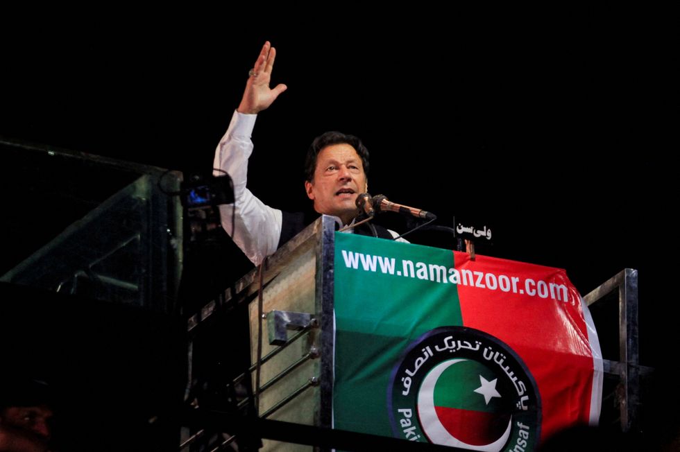 FILE PHOTO: Ousted Pakistani Prime Minister Imran Khan gestures as he addresses supporters during a rally, in Lahore, Pakistan April 21, 2022. REUTERS/Mohsin Raza//File Photo
