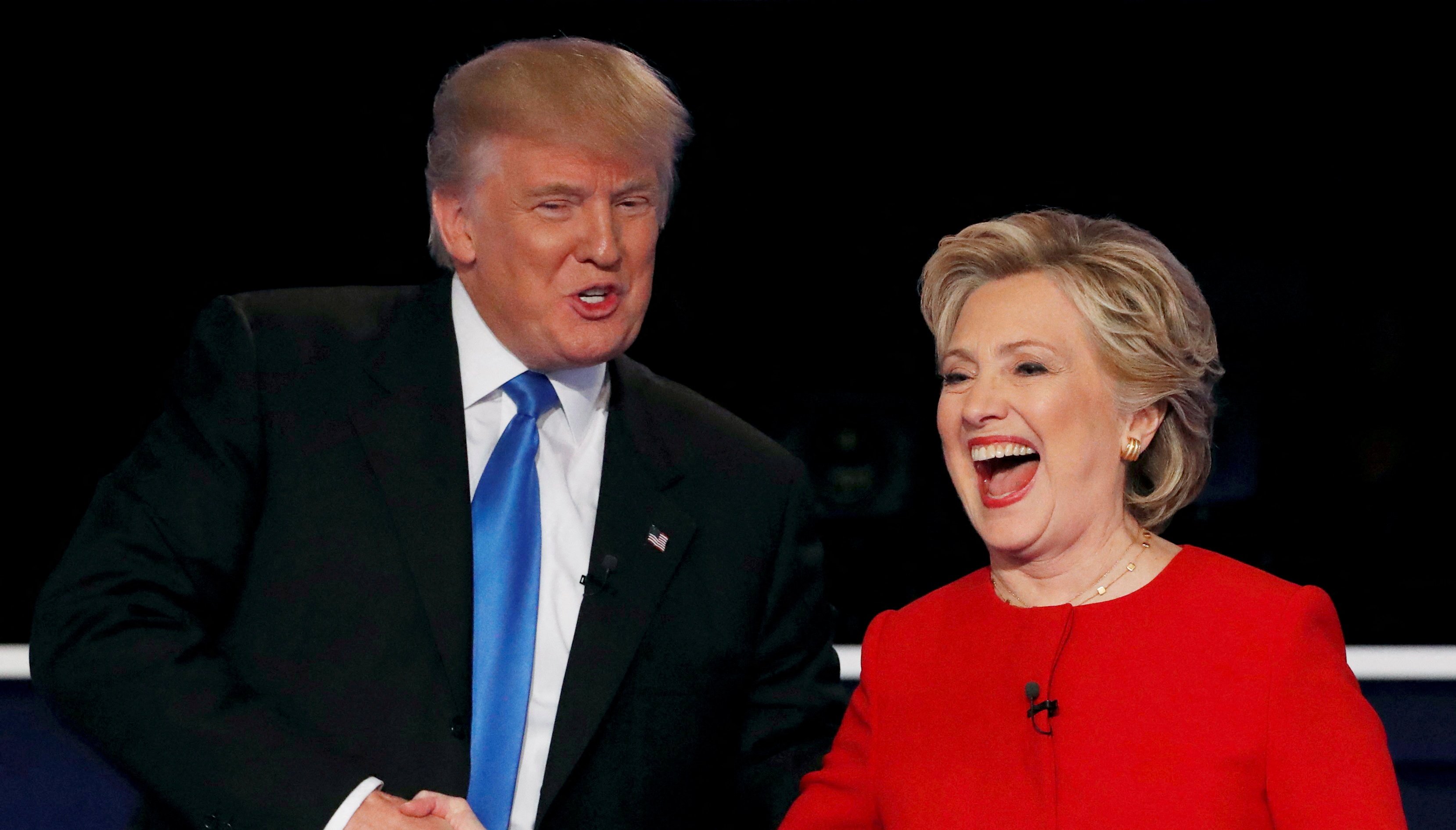 FILE PHOTO: Republican U.S. presidential nominee Donald Trump shakes hands with Democratic U.S. presidential nominee Hillary Clinton at the conclusion of their first presidential debate at Hofstra University in Hempstead, New York, U.S., September 26, 2016. REUTERS/Mike Segar/File Photo/File Photo