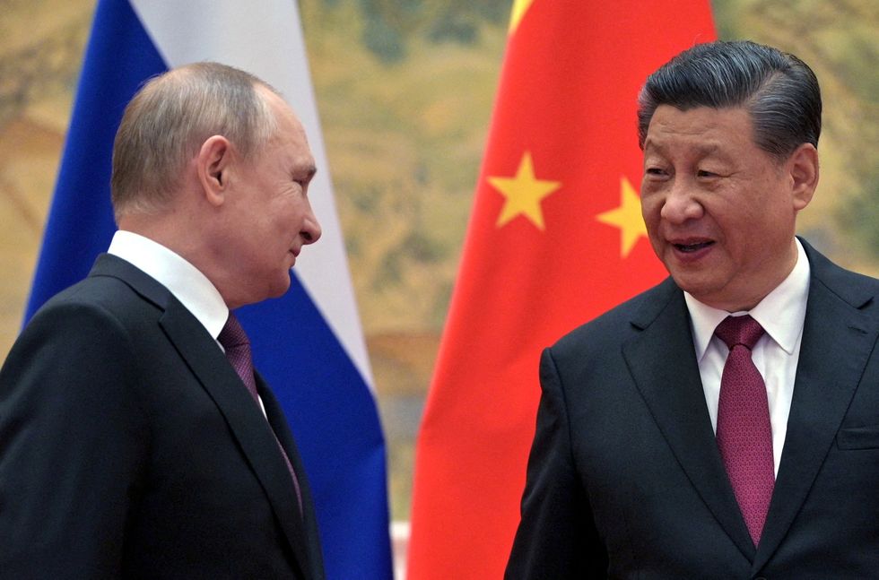FILE PHOTO: Russian President Vladimir Putin attends a meeting with Chinese President Xi Jinping in Beijing, China February 4, 2022. Sputnik/Aleksey Druzhinin/Kremlin via REUTERS ATTENTION EDITORS - THIS IMAGE WAS PROVIDED BY A THIRD PARTY./File Photo