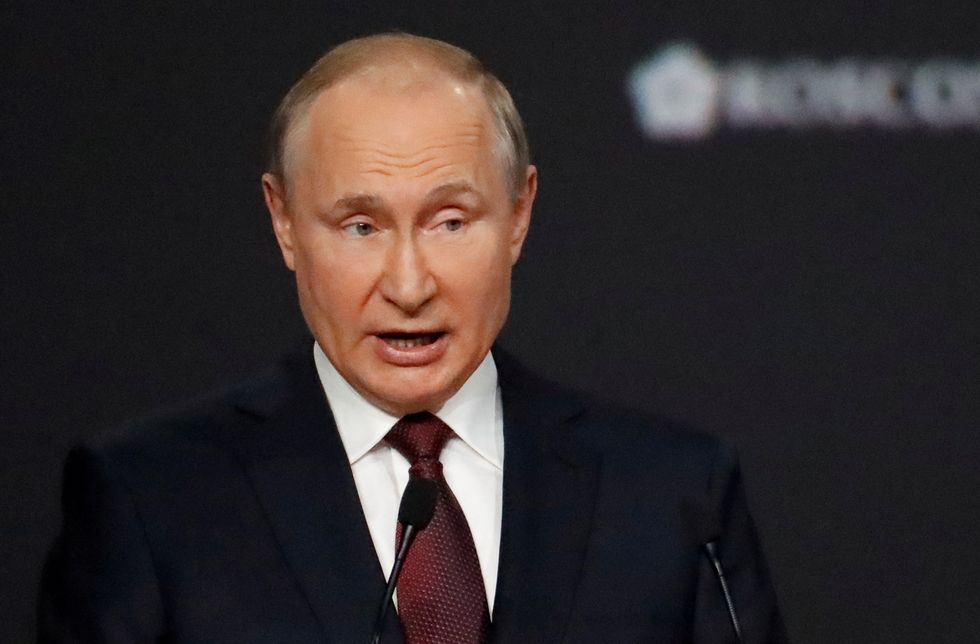 FILE PHOTO: Russian President Vladimir Putin delivers a speech during a session of the St. Petersburg International Economic Forum (SPIEF) in Saint Petersburg, Russia, June 4, 2021. Anatoly Maltsev/Pool via REUTERS/File Photo