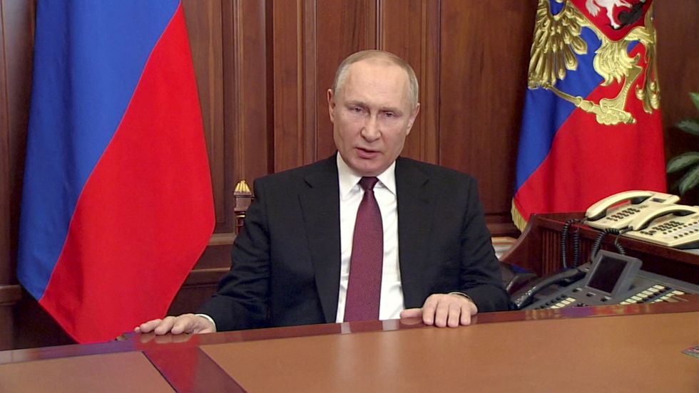 FILE PHOTO: Russian President Vladimir Putin delivers a video address announcing the start of the military operation in eastern Ukraine, in Moscow, Russia, in a still image taken from video footage released February 24, 2022. Russian Pool/Reuters TV via REUTERS ATTENTION EDITORS - THIS IMAGE WAS PROVIDED BY A THIRD PARTY./File Photo