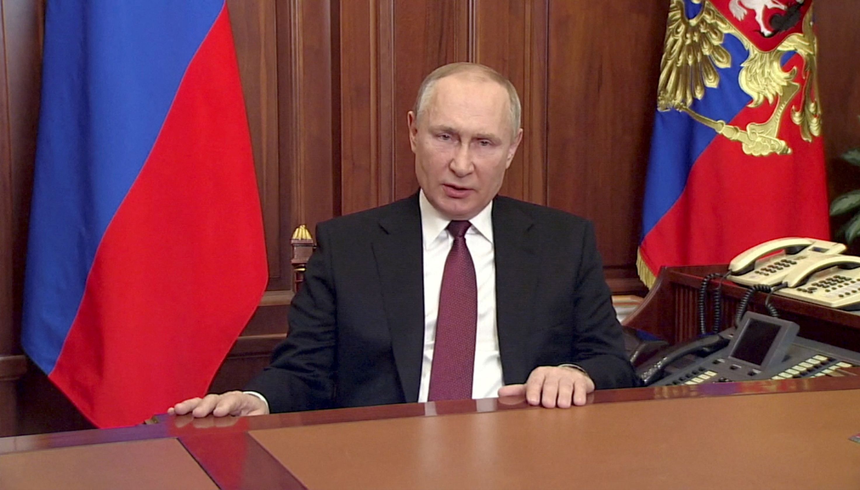 FILE PHOTO: Russian President Vladimir Putin delivers a video address announcing the start of the military operation in eastern Ukraine, in Moscow, Russia, in a still image taken from video footage released February 24, 2022. Russian Pool/Reuters TV via REUTERS ATTENTION EDITORS - THIS IMAGE WAS PROVIDED BY A THIRD PARTY./File Photo