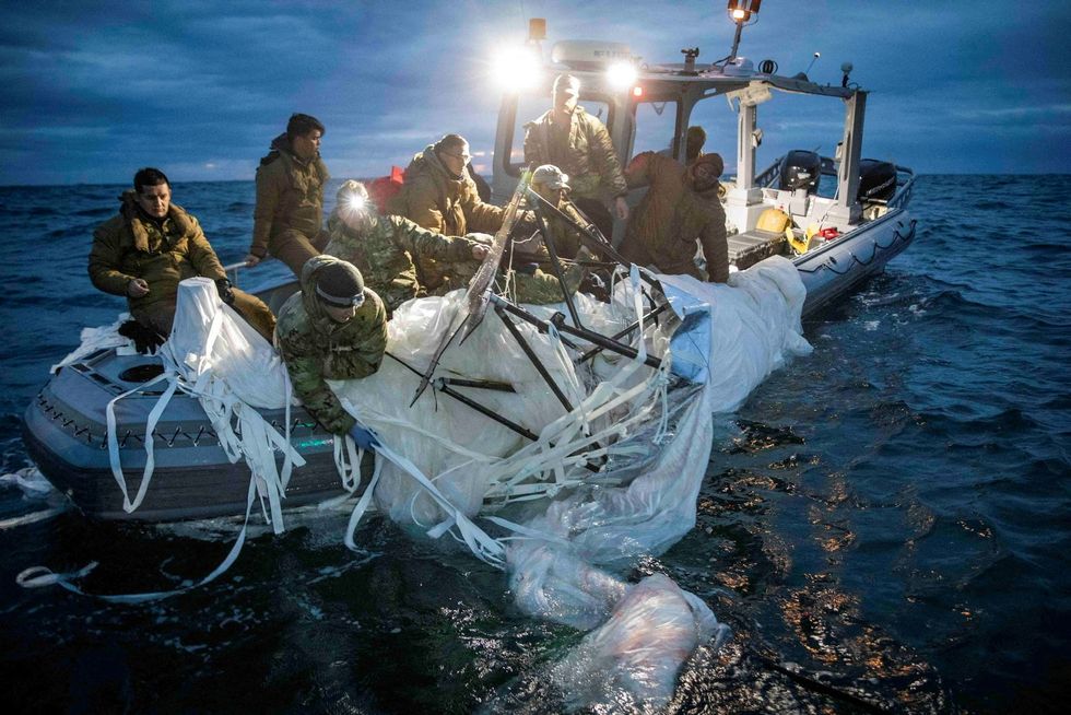 FILE PHOTO: Sailors assigned to Explosive Ordnance Disposal Group 2 recover a suspected Chinese high-altitude surveillance balloon that was downed by the United States over the weekend over U.S. territorial waters off the coast of Myrtle Beach, South Carolina, U.S., February 5, 2023. U.S. Fleet Forces/U.S. Navy photo/Handout via REUTERS//File Photo