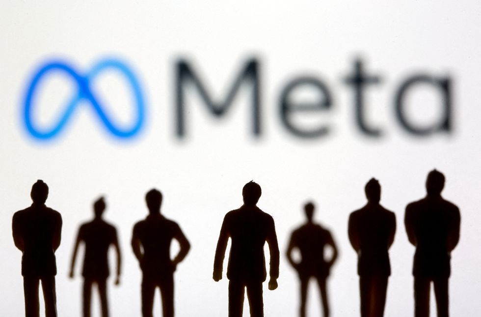 FILE PHOTO: Small toy figures are seen in front of displayed Facebook's new rebrand logo Meta in this illustration taken, October 28, 2021. REUTERS/Dado Ruvic/Illustration/File Photo