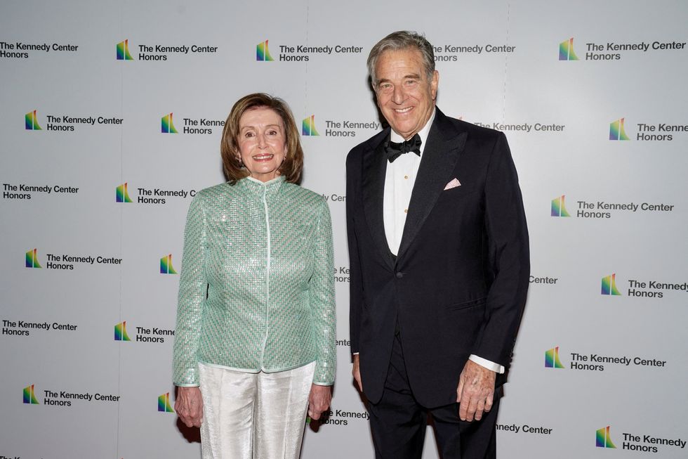 FILE PHOTO: Speaker of the House Nancy Pelosi, D-CA and her husband Paul Pelosi arrive for the formal Artist's Dinner honoring the recipients of the 44th Annual Kennedy Center Honors at the Library of Congress in Washington, D.C., U.S., December 4, 2021. REUTERS/Ken Cedeno/File Photo