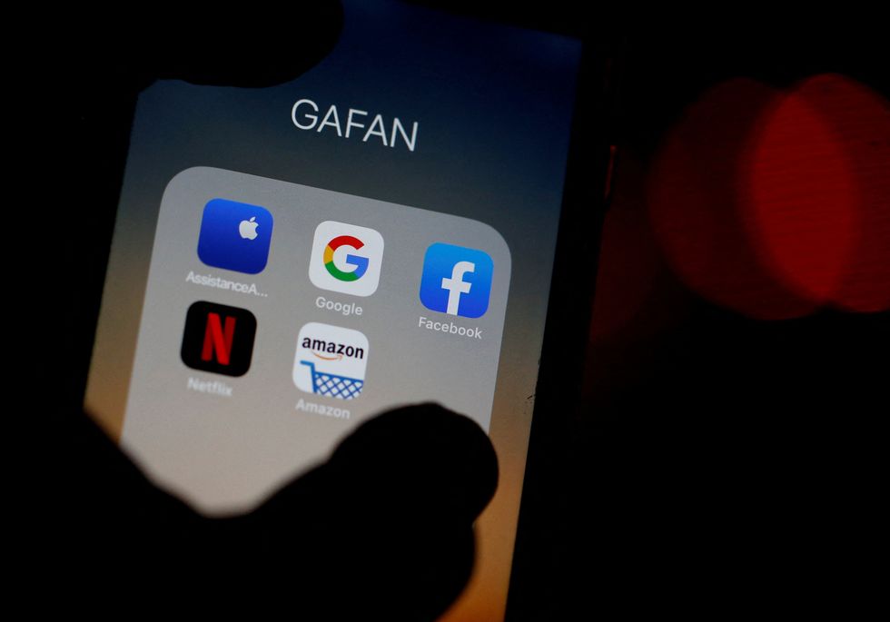 FILE PHOTO: The logos of mobile apps, Google, Amazon, Facebook, Apple and Netflix, are displayed on a screen in this illustration picture taken December 3, 2019. REUTERS/Regis Duvignau/File Photo