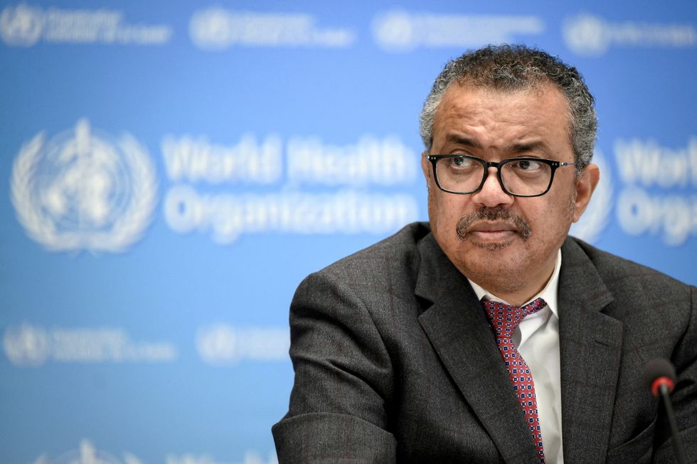 FILE PHOTO: World Health Organization chief Tedros Adhanom Ghebreyesus attends a ceremony to launch a multiyear partnership with Qatar on making FIFA Football World Cup 2022 and mega sporting events healthy and safe at the WHO headquarters, in Geneva, Switzerland, October 18, 2021. Fabrice Coffrini/ Pool via REUTERS/File Photo