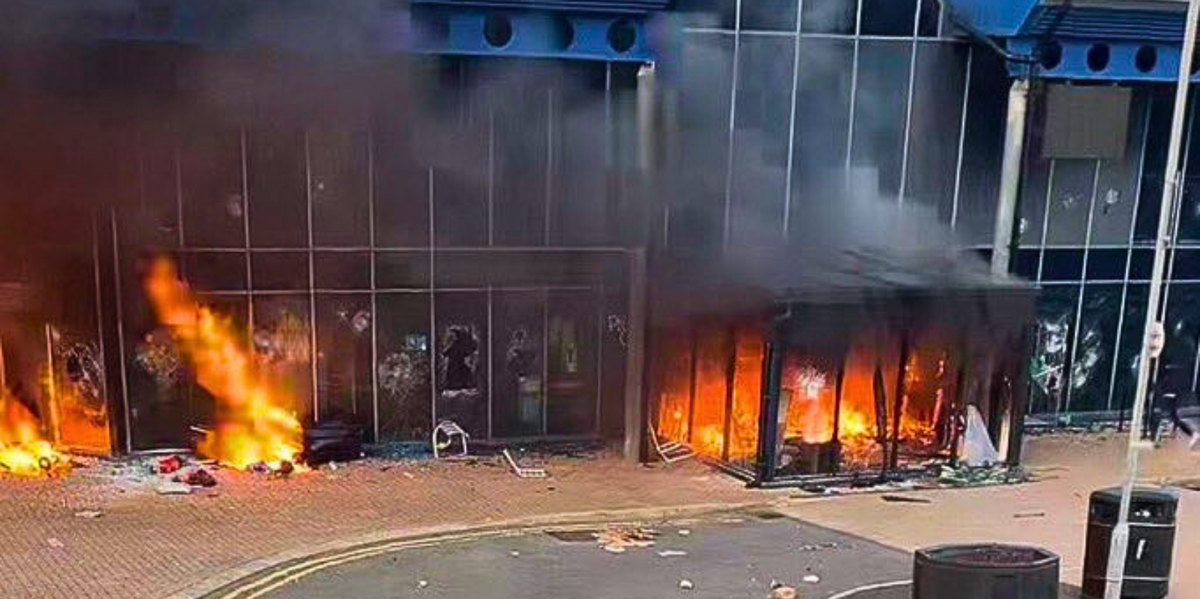 NextImg:THIRD night of violence erupts in Northern Ireland as 'masked youths' smash windows and start fires at 'emergency rest centre'
