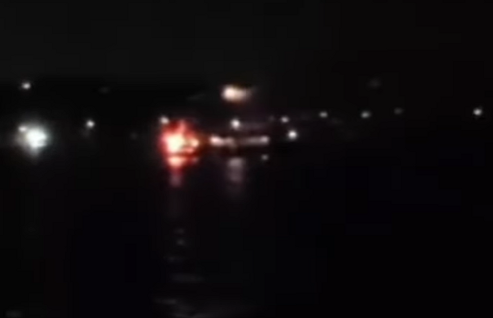 Fire burning on the rear of the 'Family Boat'