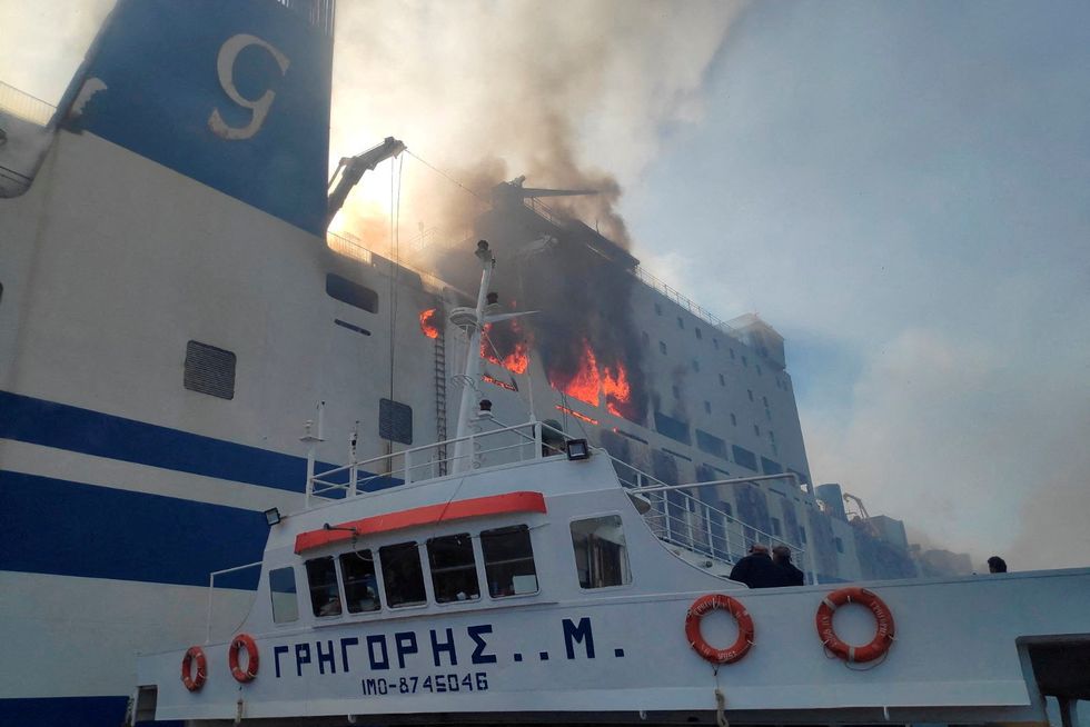 Fire burns on the Italian-flagged Euroferry Olympia off the island of Corfu, Greece, February 18, 2022. Hellenic Fire Service/Handout via REUTERS ATTENTION EDITORS - THIS IMAGE WAS PROVIDED BY A THIRD PARTY. NO RESALES. NO ARCHIVE.     TPX IMAGES OF THE DAY