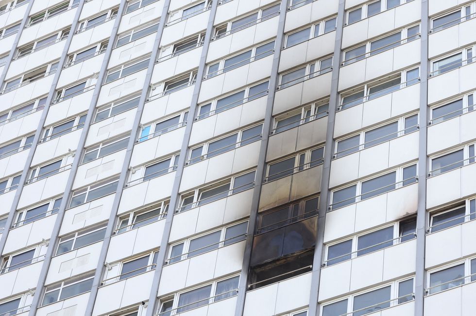 Fire damage is seen at an apartment at Queensdale Crescent tower block, near the Grenfell Tower, in Shepherd's Bush, London, Britain June 21, 2022. REUTERS/Kevin Coombs
