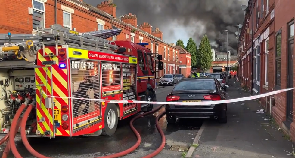 Fire engine with smoke in background
