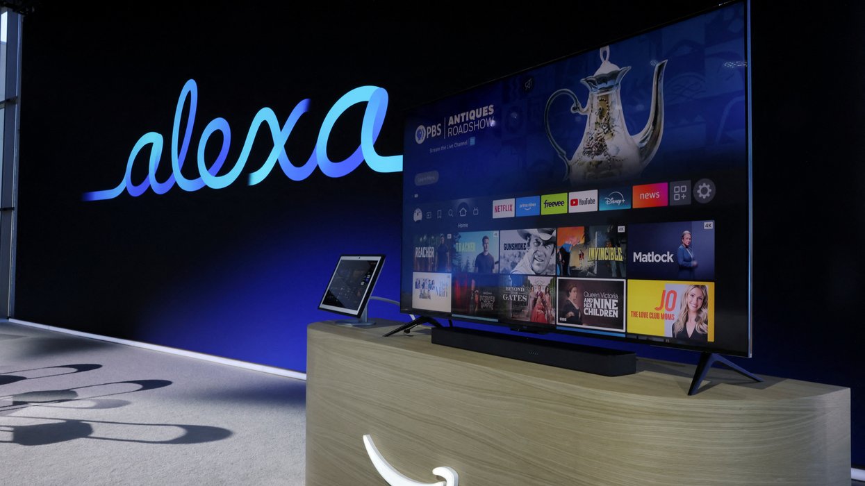 fire tv and echo show on-stage at the amazon event with the alexa logo in the background