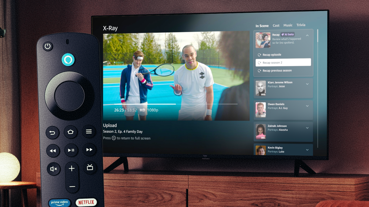 fire tv remote control in the foreground with the new x-ray recap feature on-screen in Prime Video in the background