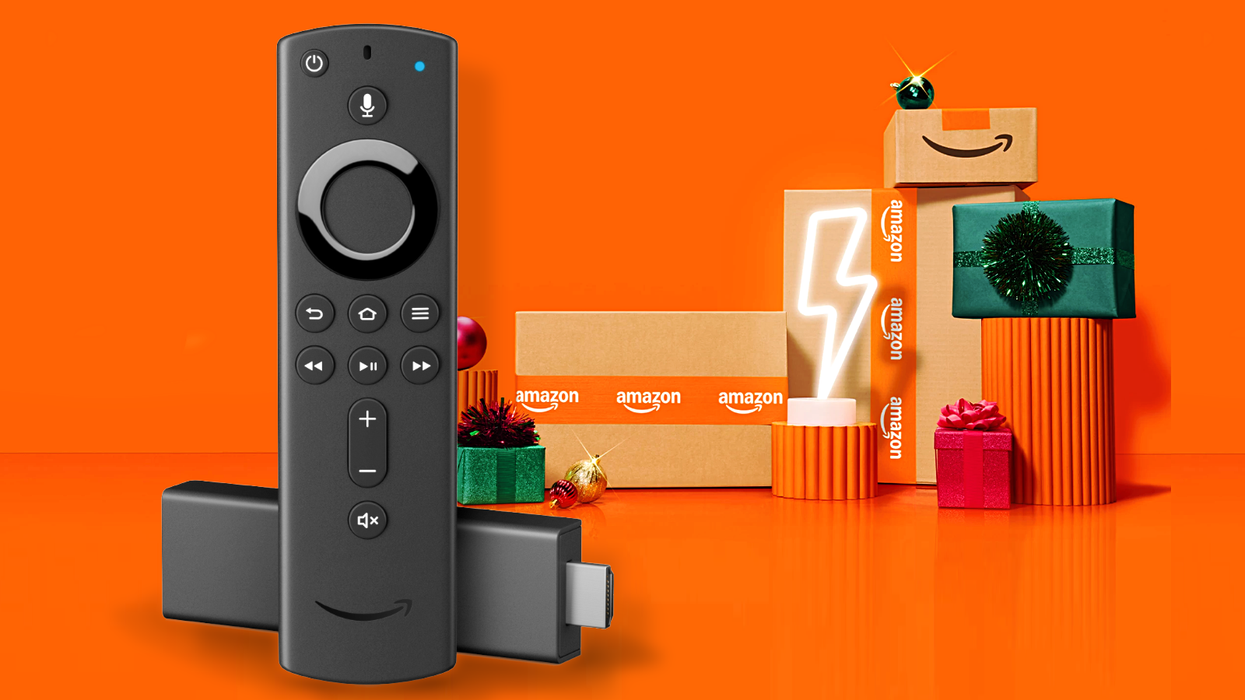 Fire TV Stick 4K pictured with its Alexa Voice Remote and Amazon branded delivery boxes in the background