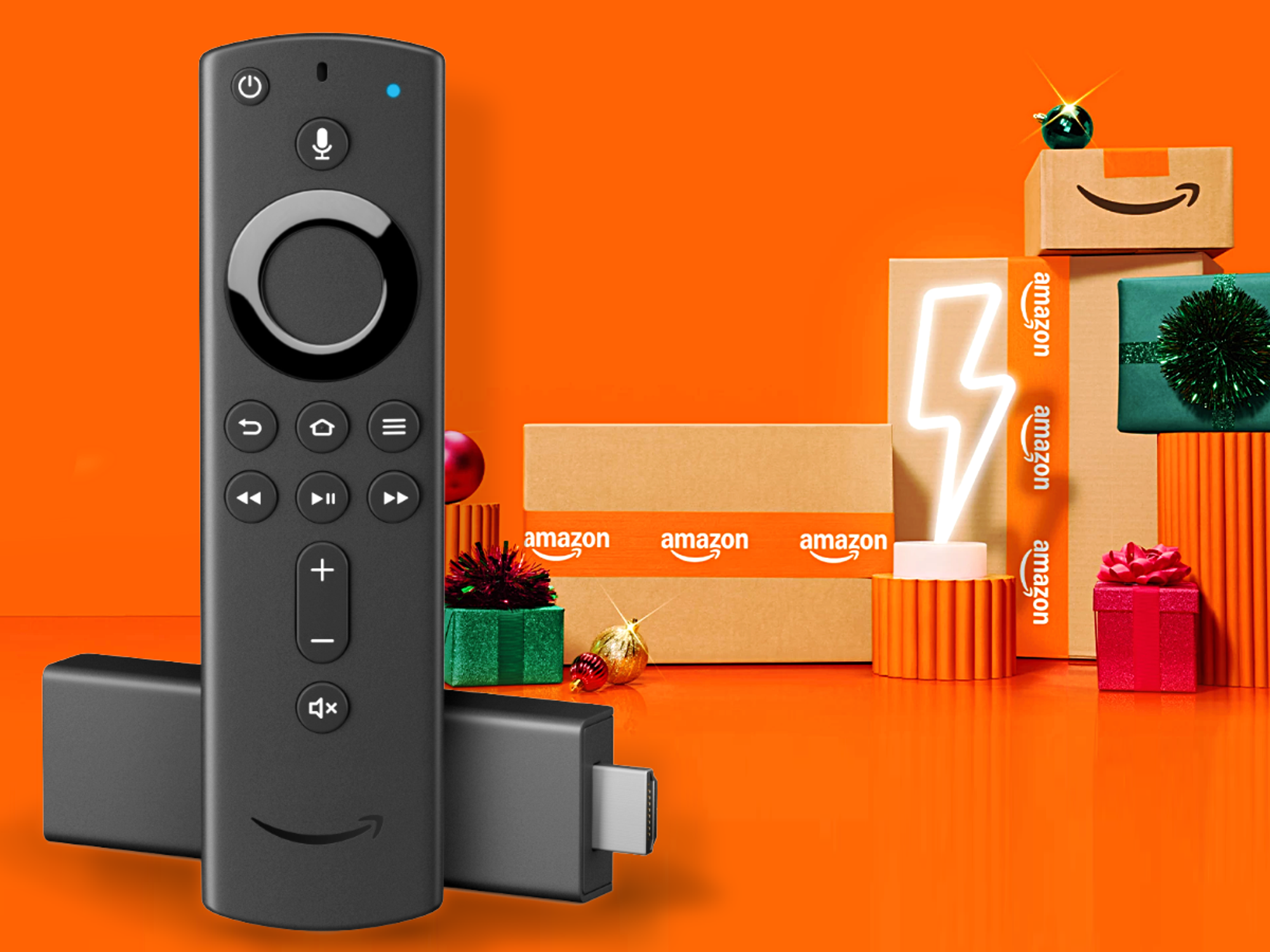 Fire TV Stick 4K pictured with its Alexa Voice Remote and Amazon branded delivery boxes in the background