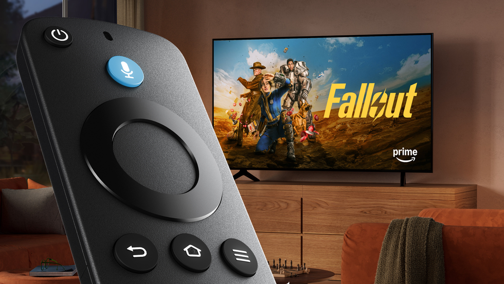 fire tv stick 4k select remote with fallout showing on the television in the background