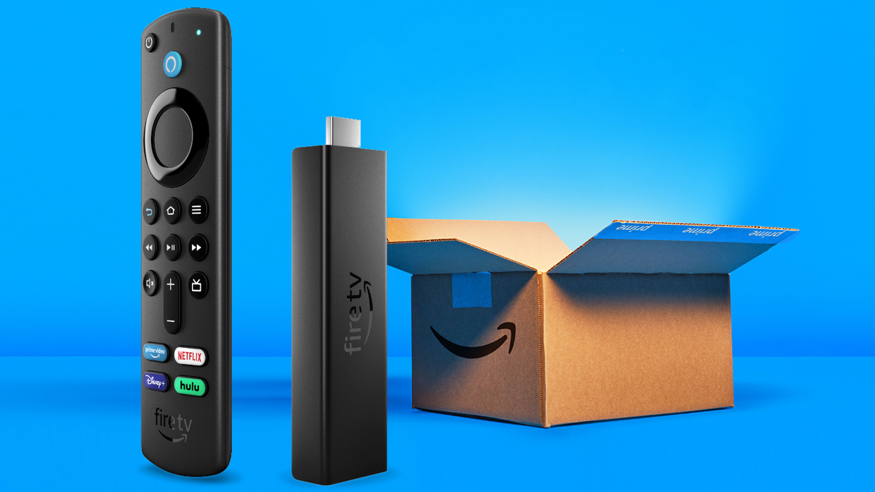 fire tv stick 4k with an amazon shipping box in the background