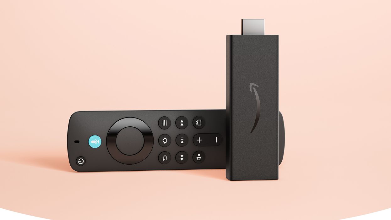 fire tv stick hd pictured on its side with a pink background